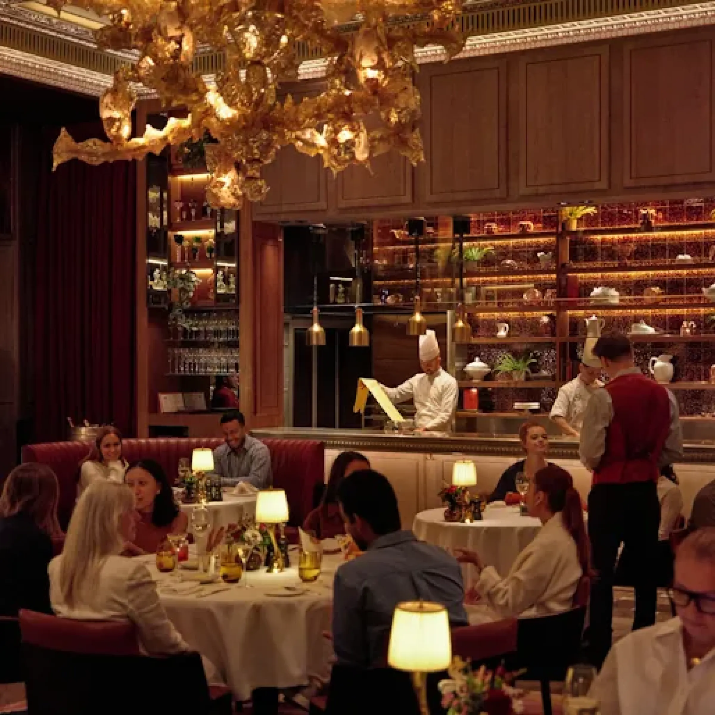 Dark-panelled Art Deco dining room representing the Savoy Grill